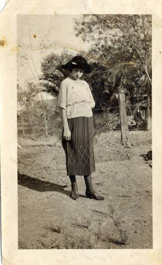 Teen age girl standing in a year