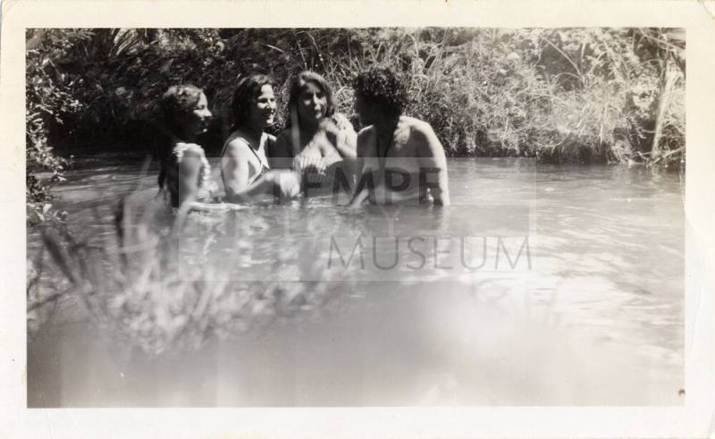 Carmina and Sophia Carrisoza, Rosa Scott, and Paula Obregon standing in the Tempe Canal