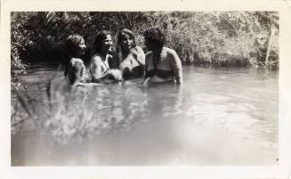 Carmina and Sophia Carrisoza, Rosa Scott, and Paula Obregon standing in the Tempe Canal