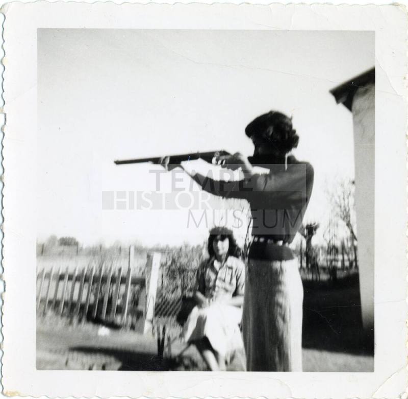 "Marcie, the cutest girl in Tempe" with a gun