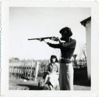 "Marcie, the cutest girl in Tempe" with a gun