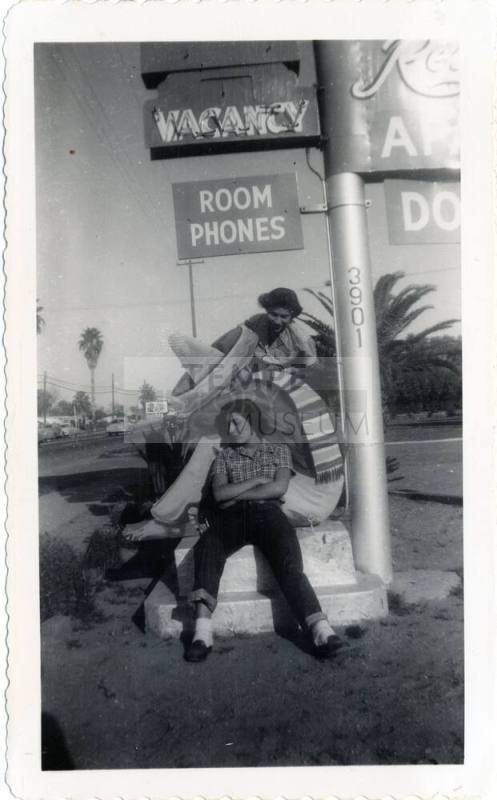 Annie Gomez and Katy Ramirez at Van Buren motel sign