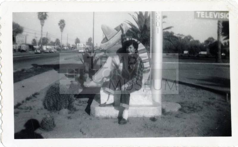 Genevieve Puerta at Van Buren motel sign, Phoenix