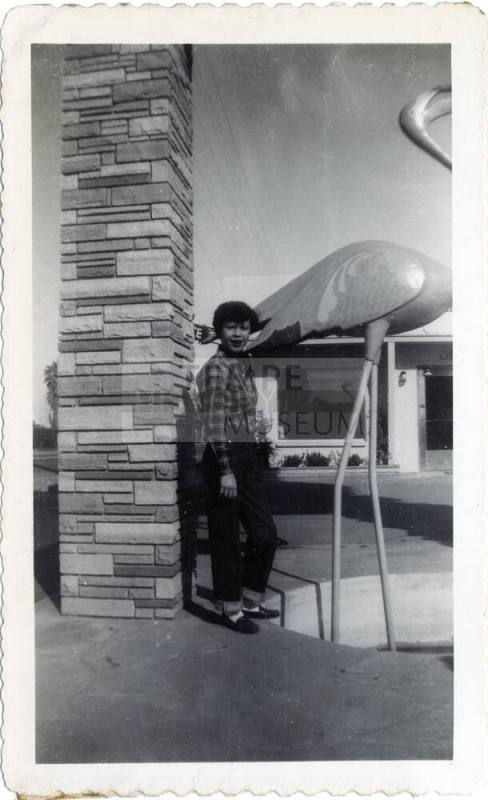 Genevieve Puerta by flamingo statue on Van Buren Street, Phoenix