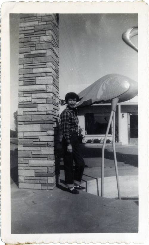 Genevieve Puerta by flamingo statue on Van Buren Street, Phoenix