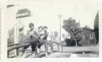 Marcie Rodriguez and friends in front of a  Van Buren motel, Phoenix