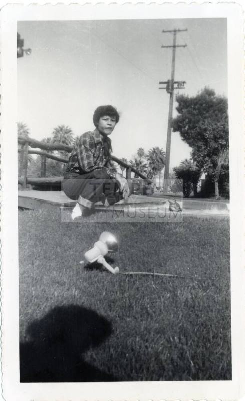Genevieve Puerta on lawn of a Van Buren motel, Phoenix