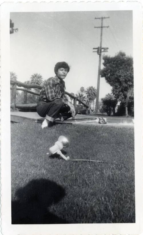 Genevieve Puerta on lawn of a Van Buren motel, Phoenix
