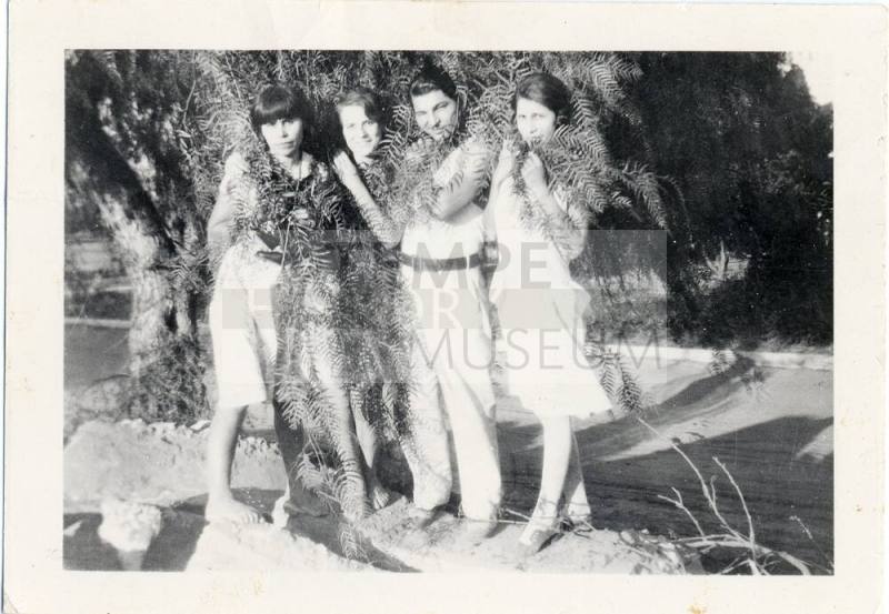 Marcie, Ray and two others wrapped in Foliage