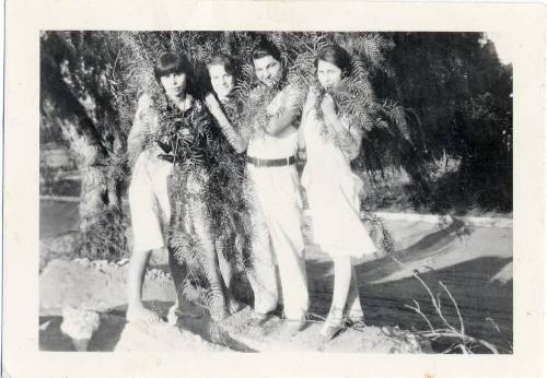 Marcie, Ray and two others wrapped in Foliage