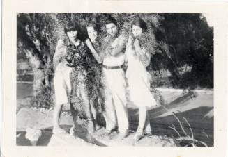 Marcie, Ray and two others wrapped in Foliage