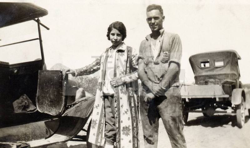 Irene, a companion, and two vintage vehicles