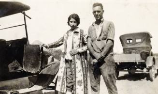 Irene, a companion, and two vintage vehicles