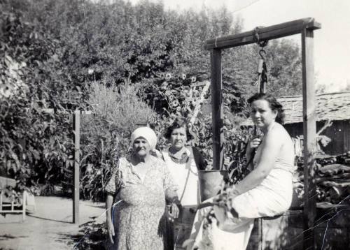 Women at a well at Rural Road near 8th Street