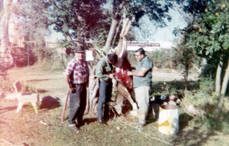 Hunters with hanging deer at Elias-Rodriguez house