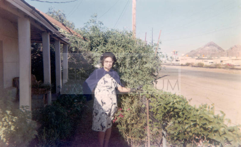 Inez Elias-Rodriguez in front yard