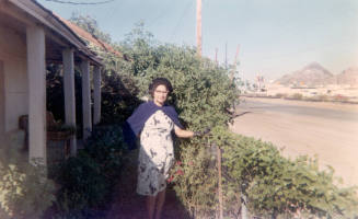 Inez Elias-Rodriguez in front yard