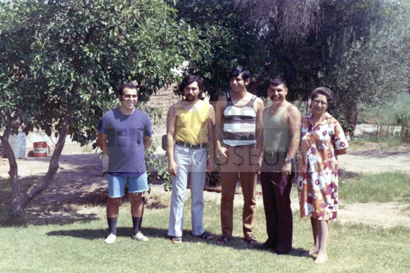Irene Elias-Rodriguez with four young men