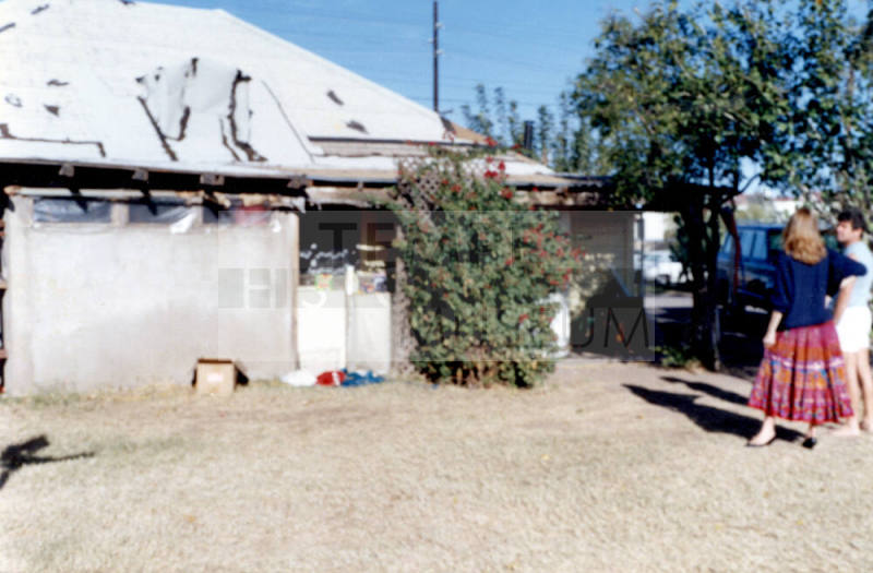 Back of Elias-Rodriguez house with roof damage