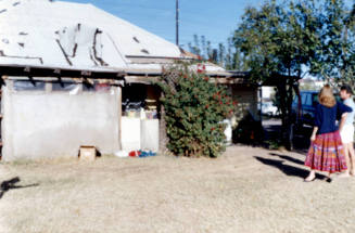Back of Elias-Rodriguez house with roof damage