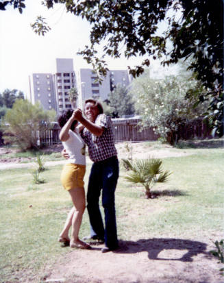 Couple dancing in backyard of Elias-Rodriguez house