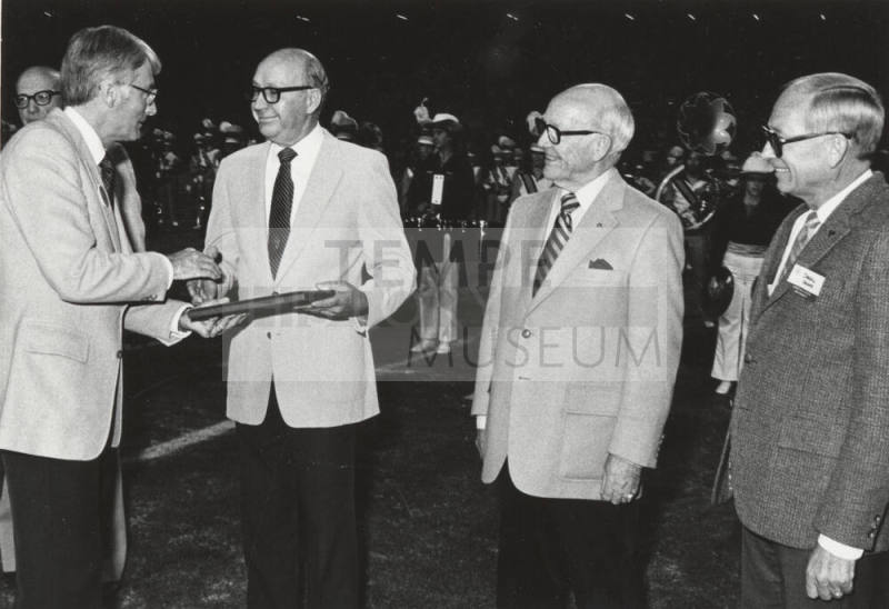 Rudy Campbell Gives Plaque to J.R. Nelson