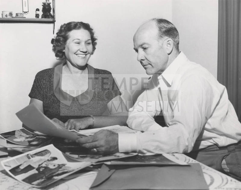 Howard and Lucile Pyle Looking at Photos