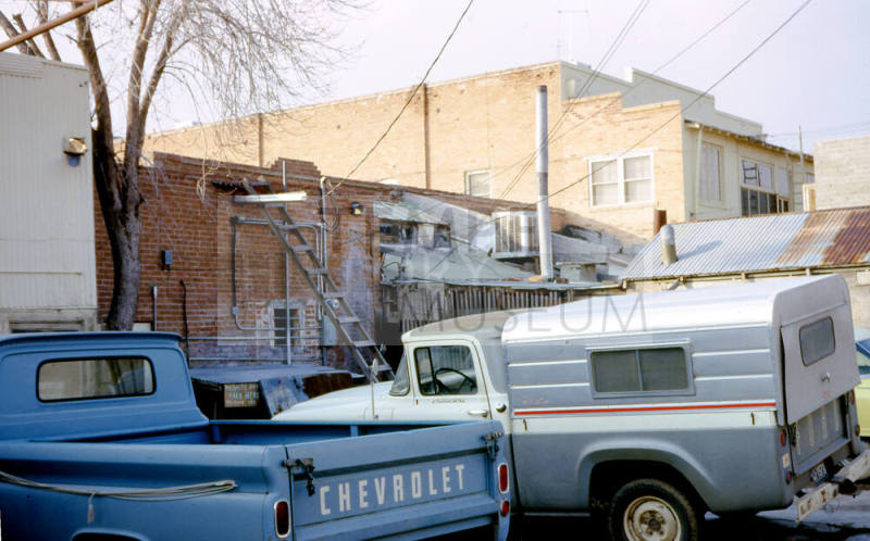 Vehicles parked in Alley East of Mill Ave.