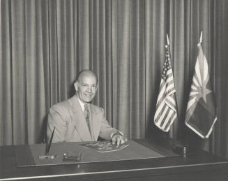 Howard Pyle at Desk with U.S. and AZ Flags
