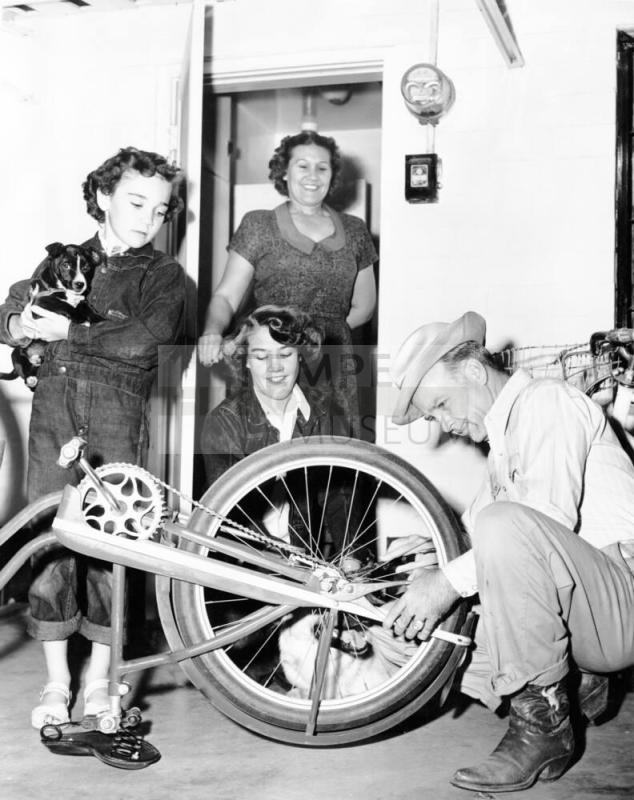 Howard Pyle Working on Bicycle, and Family