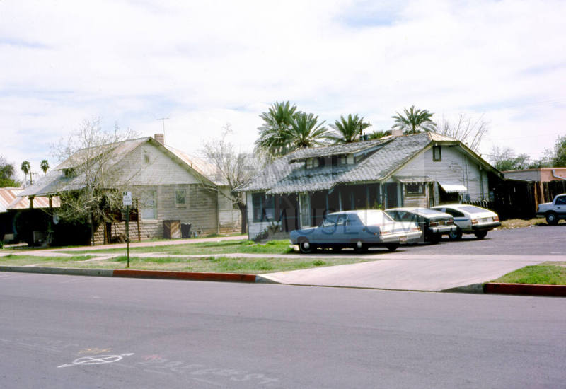27 E. 6th Street - A house and parking lot next to a store