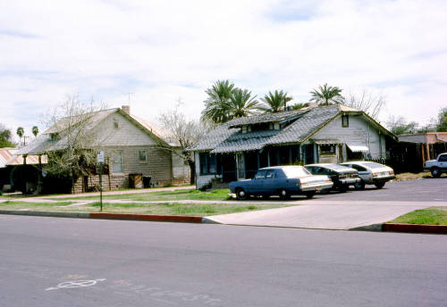 27 E. 6th Street - A house and parking lot next to a store