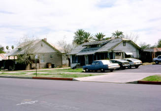 27 E. 6th Street - A house and parking lot next to a store