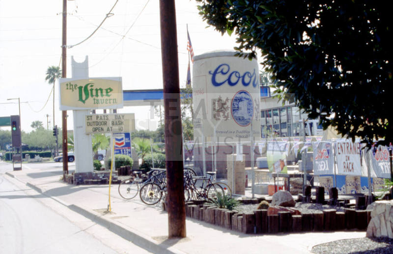 Vine Tavern Sign with inflatable Coor's Bottle, 801 E. Apache