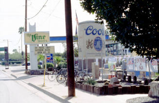 Vine Tavern Sign with inflatable Coor's Bottle, 801 E. Apache
