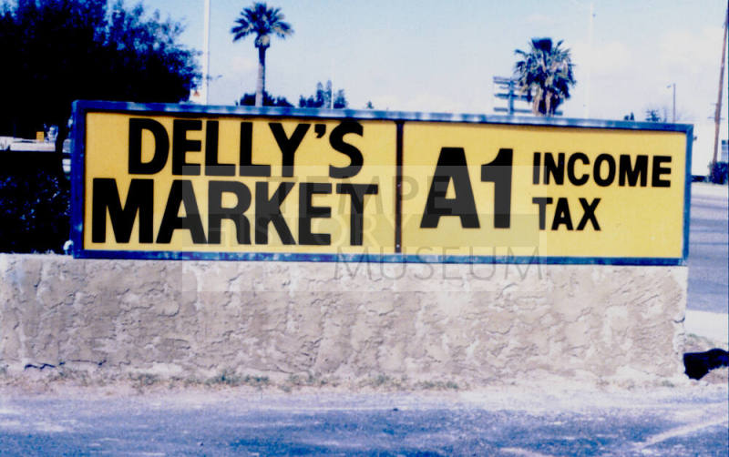 Delly's Market and A1 Income Tax Signs, 1601 E. Apache