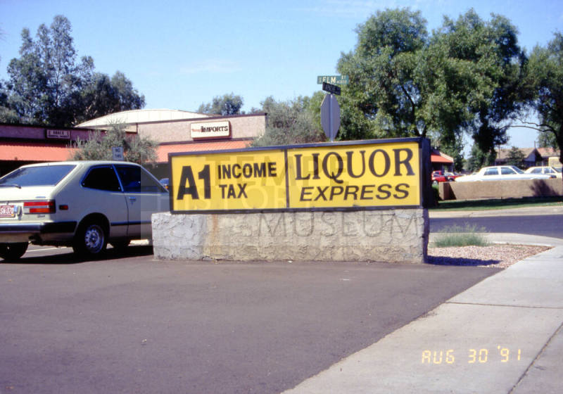 Liquor Express and A1 Income Tax Signs, 1601 E. Apache