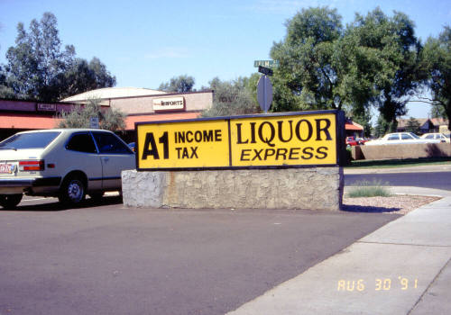 Liquor Express and A1 Income Tax Signs, 1601 E. Apache