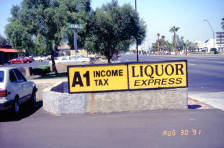 Liquor Express and A1 Income Tax Signs, 1601 E. Apache