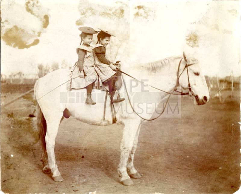 Vera and Lucille Johnson Riding Horse to School