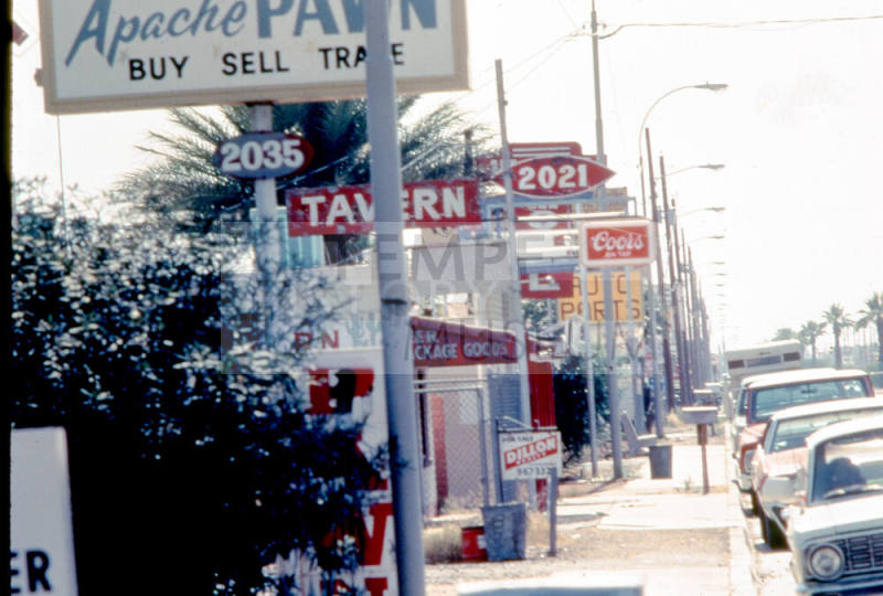 Signs on 2000 block of Apache Blvd.
