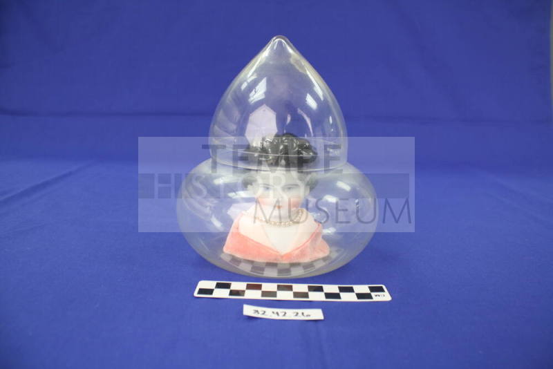 Doll Head In Glass Case