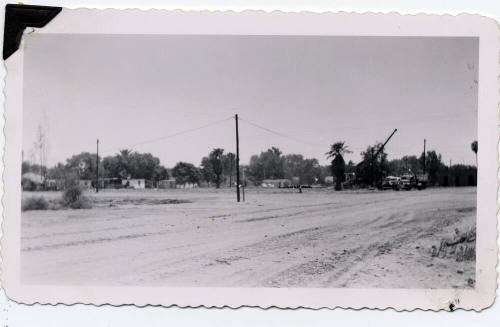 Photograph - 6th St. and East in 1957 - View of Cleared field and truck