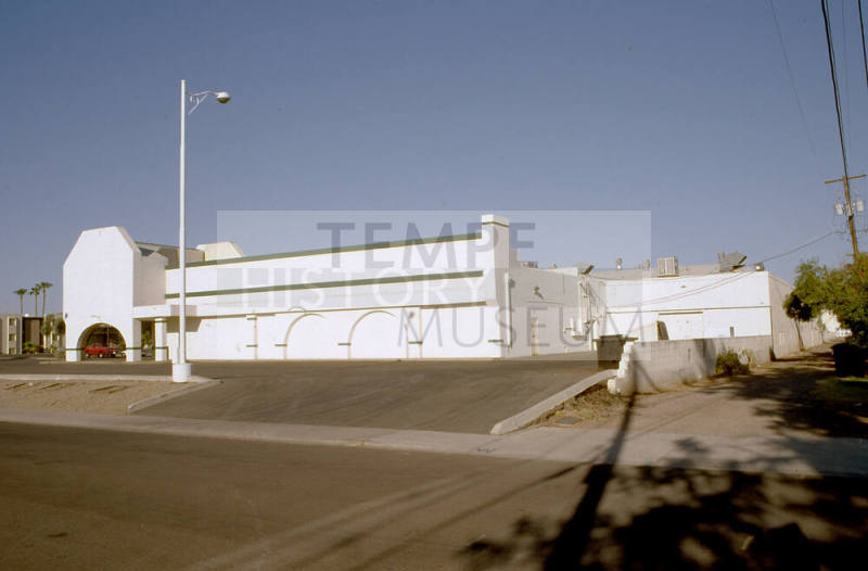 Side of shopping center, 1338 E. Apache Blvd.