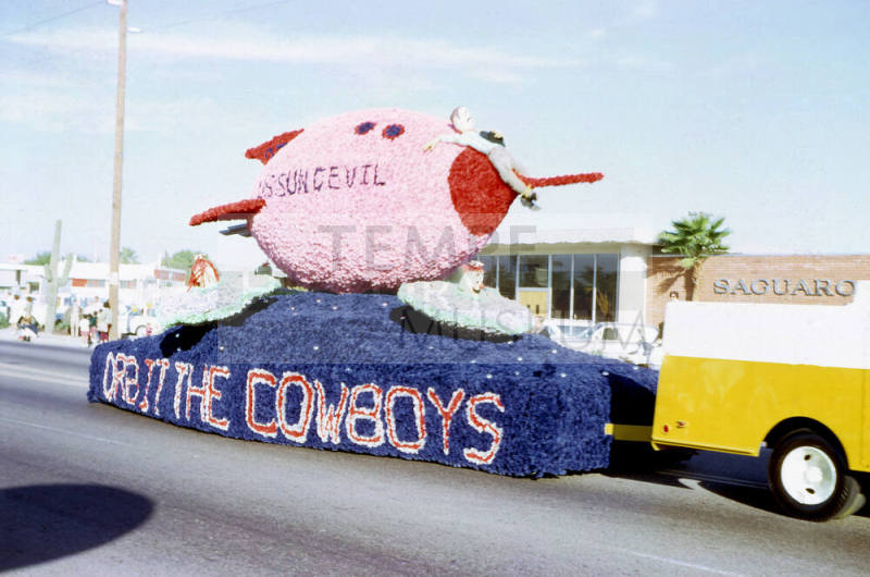 "Orbit the Cowboys" football float in Tempe Parade