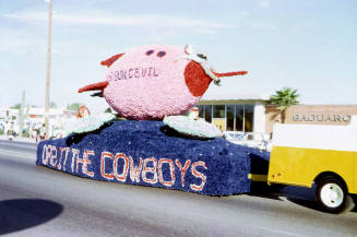 "Orbit the Cowboys" football float in Tempe Parade