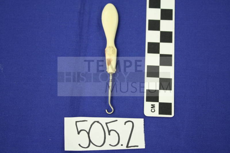 Metal buttonhook with plastic handle