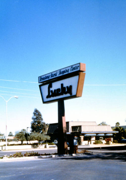 Lucky market sign, Broadway & Rural