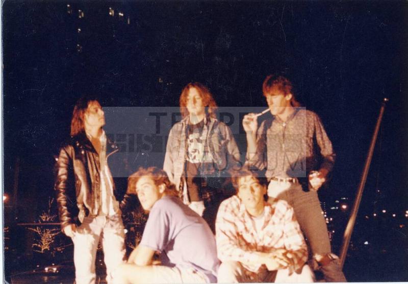 Gin Blossoms group photo outside at night