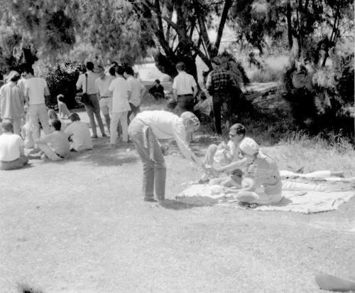 2 images of love-in, Tempe Beach Park--Couple on a blanket; seated crowd scene